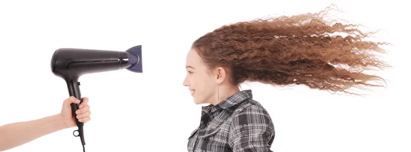 Young girl using hairdryer — Stock Photo, Image