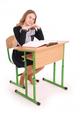 Bir masada oturan okul kız 