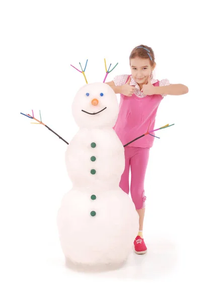 Linda chica con muñeco de nieve — Foto de Stock