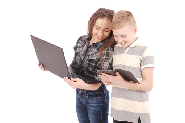 Two kids playing and surfing the web on digital tablet and laptop. — Stock Photo, Image