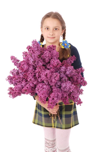 Girl teenager standing with lilac in hands — Stock Photo, Image