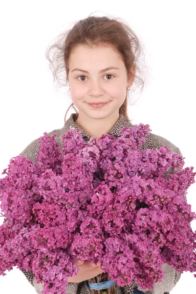 Girl teenager standing with lilac in hands — Stock Photo, Image