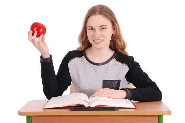 Chica de la escuela sentada en un escritorio —  Fotos de Stock