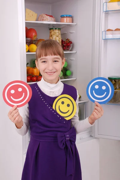 Beautiful  girl near the Fridge with healthy food.