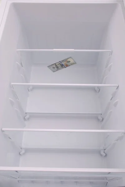 Dollars inside in empty clean refrigerator — Stock Photo, Image