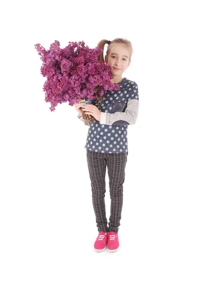 Girl teenager standing with lilac in hands — Stock Photo, Image