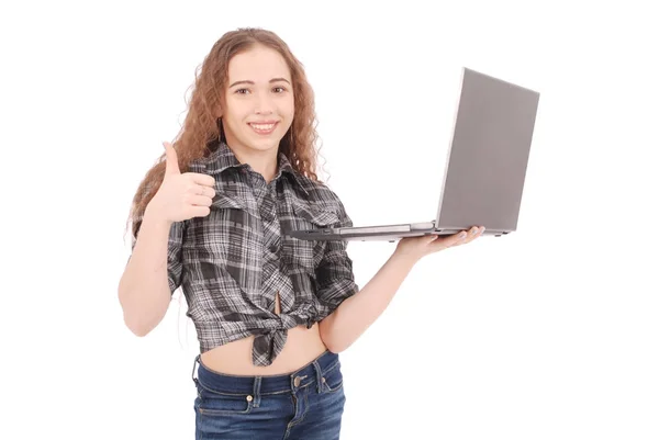 Young girl standing and using a laptop — Stock Photo, Image