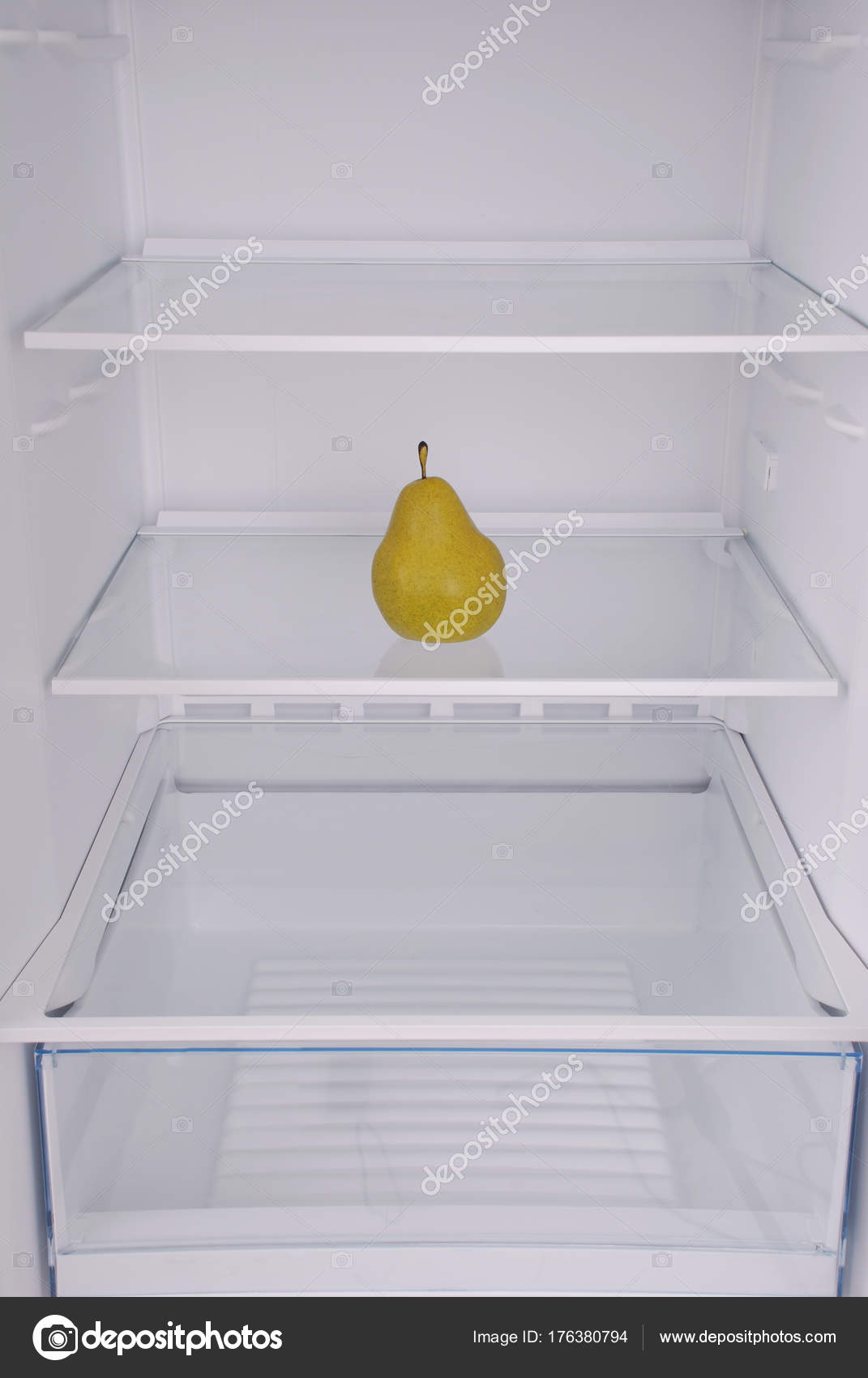 One pear in open empty refrigerator. Stock Photo by ©akova777 176380794