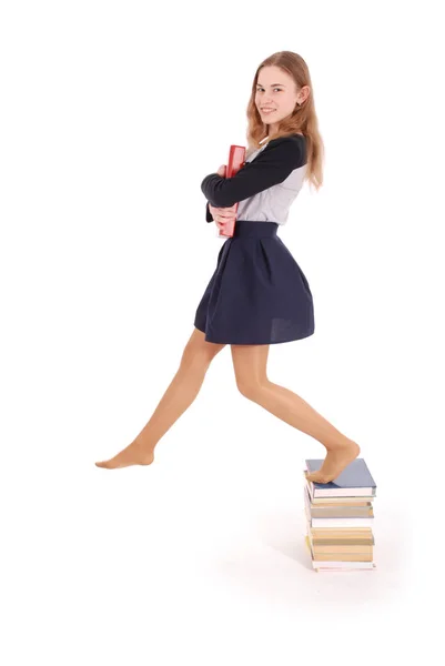 Koncepcja edukacji, ludzie, nastolatek i szkoły - nastolatek uczennice stojąc na stos książek — Zdjęcie stockowe