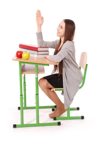 Teenager school girl raising hand to ask question — Stock Photo, Image