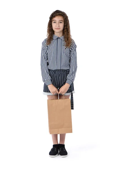 Criança com um pacote isolado em branco — Fotografia de Stock