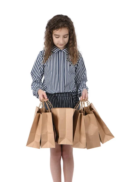 Criança com um pacote isolado em branco — Fotografia de Stock