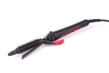 beyaz zemin üzerinde saç maşası.