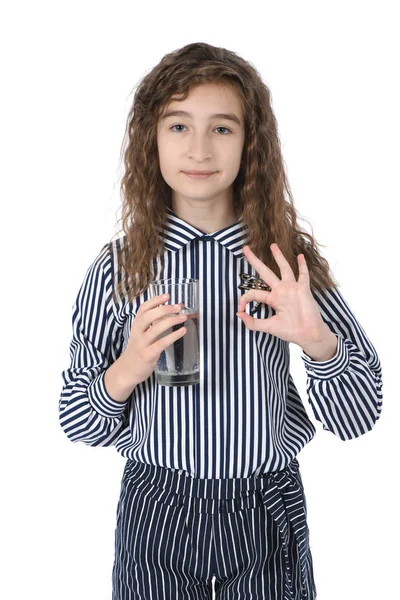 Beautiful young girl holding a glass of clean mineral water in her hand — Stock Photo, Image
