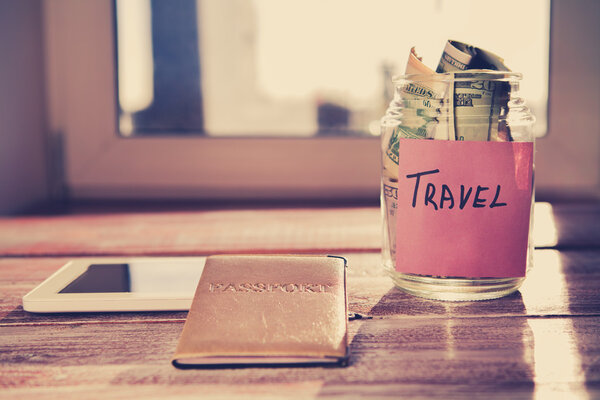 Objects for travel isolated on a wooden table close up