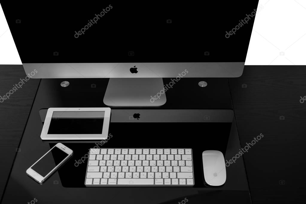 UKRAINE, RIVNE, NOVEMBER 2, 2016. Apple Computer iMac 27 retina display 5K keyboard and magic mouse on black table. isolated on a white background