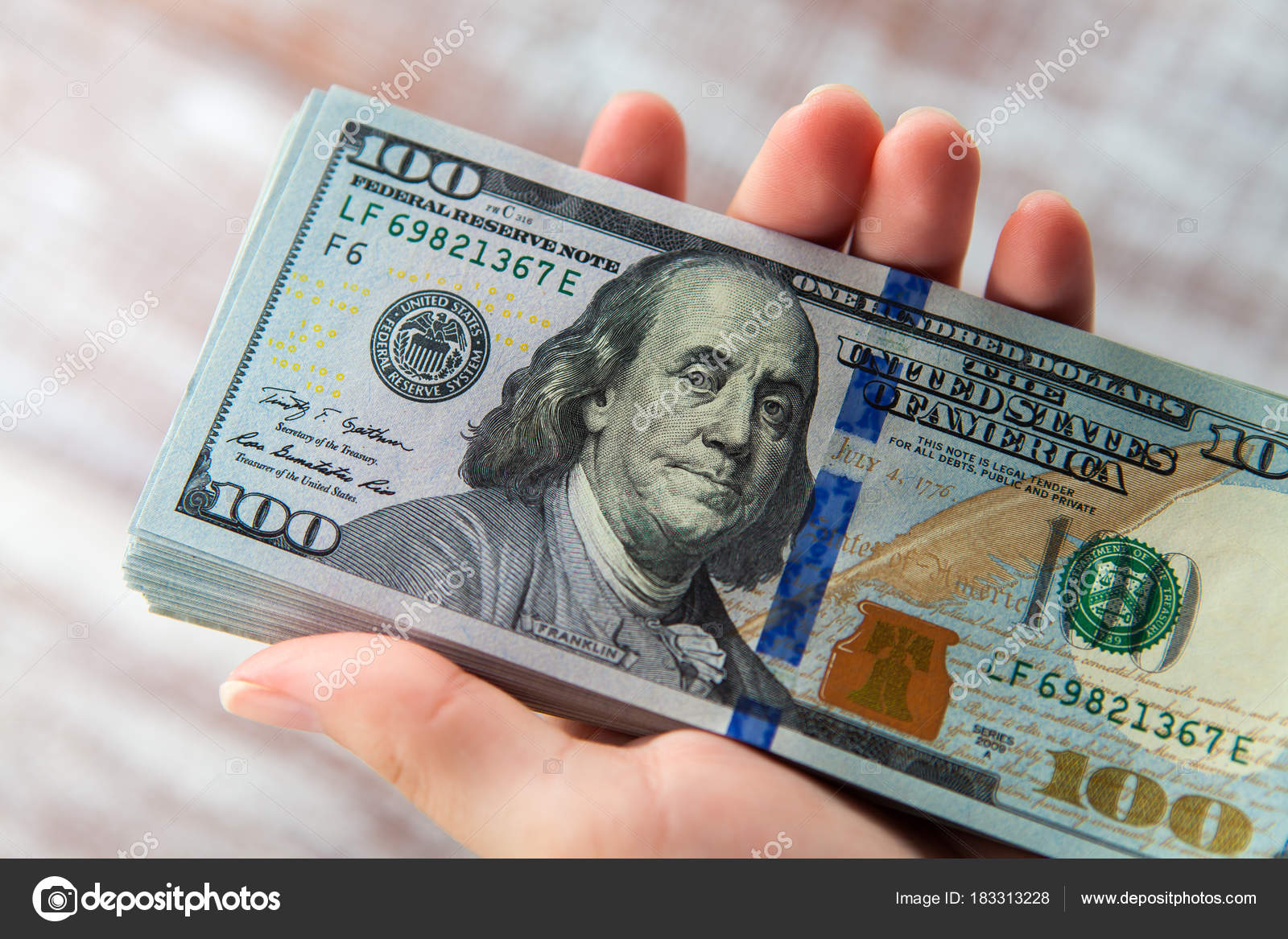 Woman holding dollars Stock Photo by ©Ivantsov 183313228
