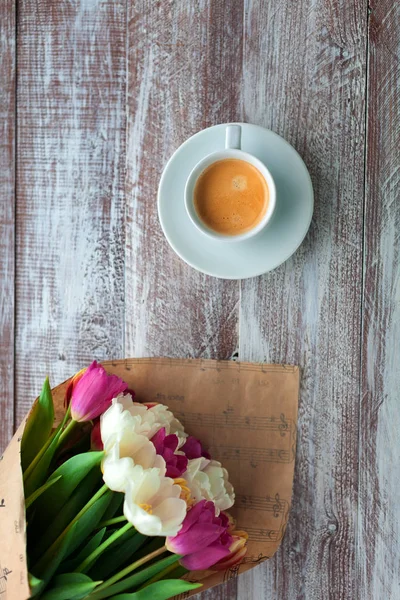 tulips and coffee on   table