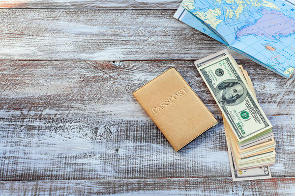 objects for travel on a wooden background.