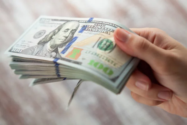 Woman holding  dollars — Stock Photo, Image