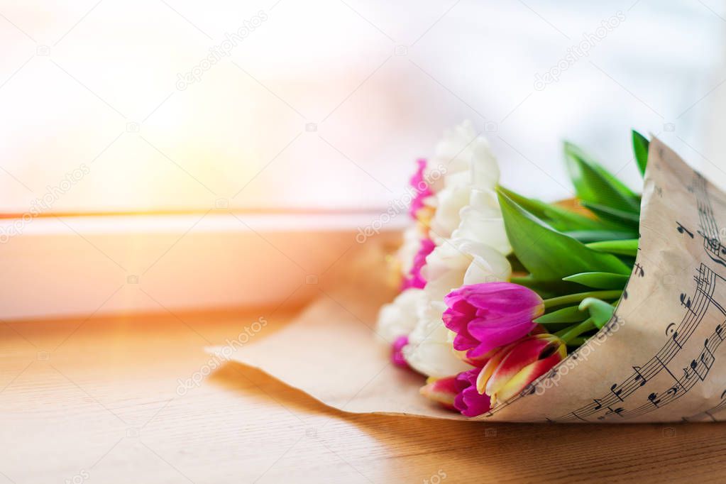 tulips and coffee on   table