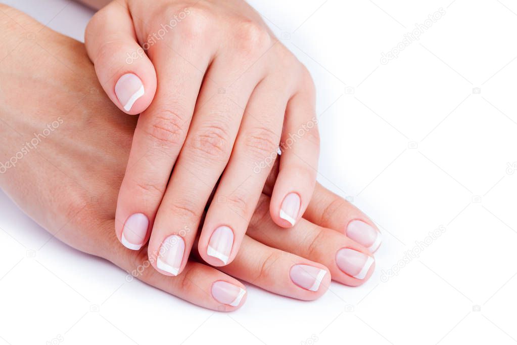 Woman hands with french manicure 