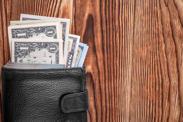 Dollars op een houten achtergrond — Stockfoto