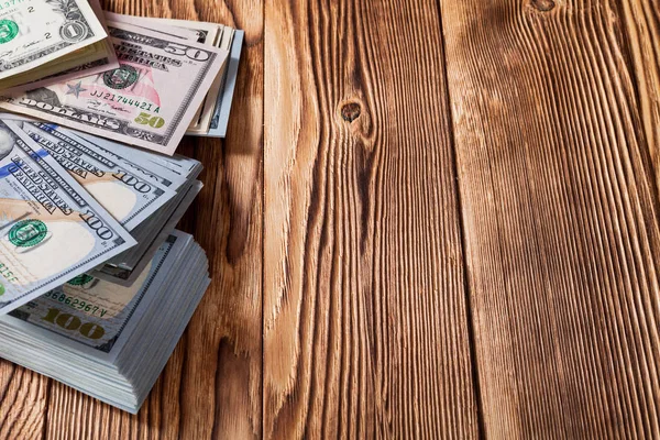 Dollar på en trä bakgrund — Stockfoto