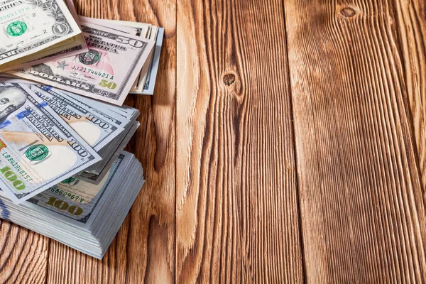 Dollar på en trä bakgrund — Stockfoto