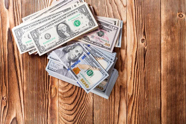 Dollars   on a wooden background — Stock Photo, Image