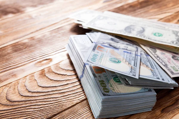 Dollars   on a wooden background — Stock Photo, Image