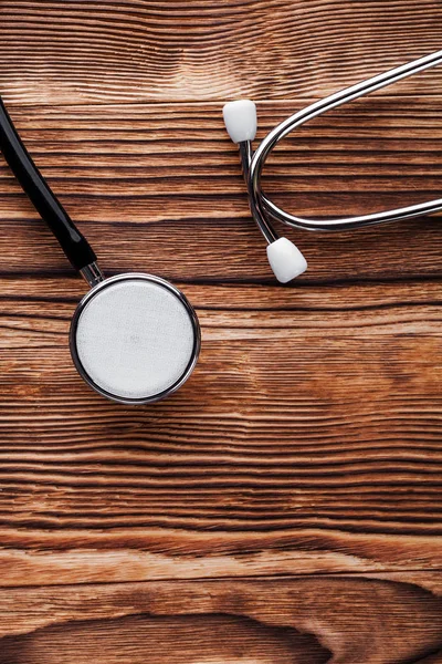 Stethoscope on wood background — Stock Photo, Image