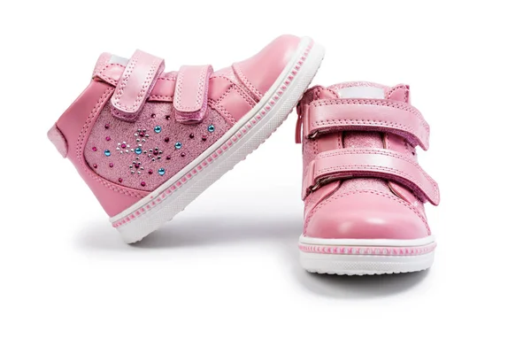 粉红色儿童运动鞋被隔离在白色背景上 — 图库照片
