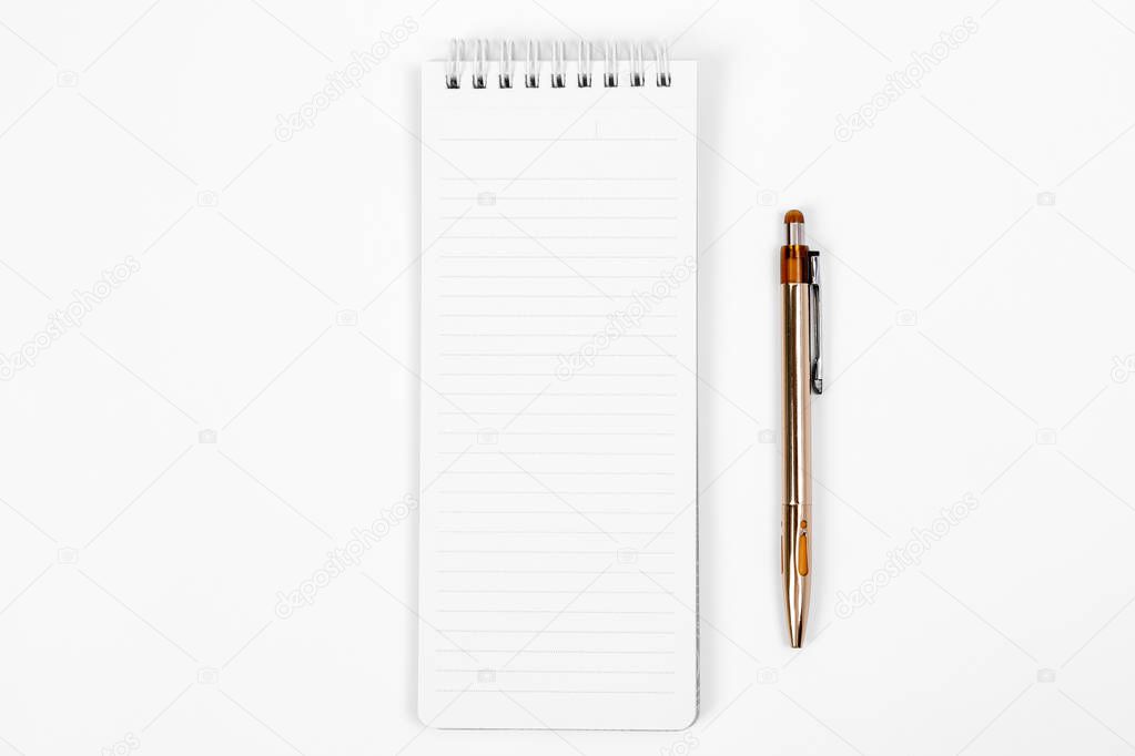 the white open notepad and computer keypad isolated on the white background