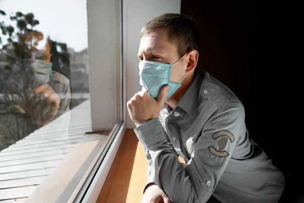Man Quarantine Because Virus Sits Home Mask Looks Out Window — Stock Photo, Image