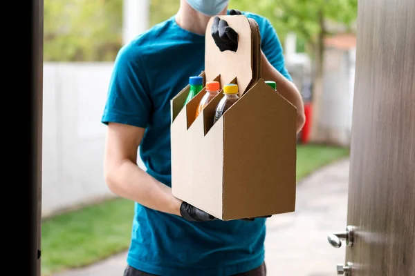 The courier delivers water from the restaurant to the house