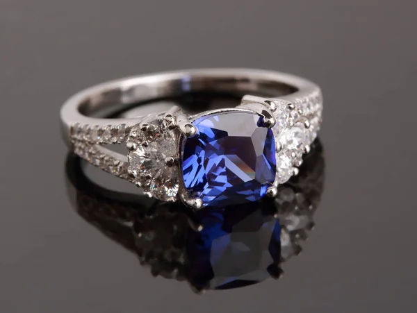 Silver ring with blue sapphire — Stock Photo, Image