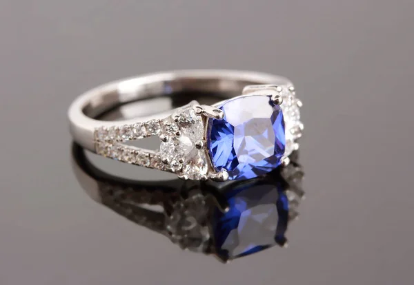 Silver ring with blue sapphire — Stock Photo, Image