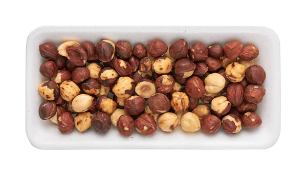 Rosta hasselnötter i paketet — Stockfoto