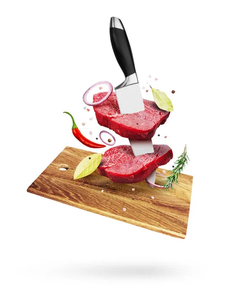 Pieces of raw beef steaks with knife, spice and pepper, over cut — Stock Photo, Image