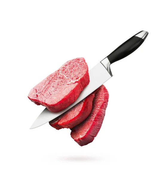 Pieces of raw beef steaks with knife — Stok fotoğraf