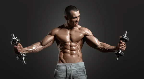 Muscular athletic bodybuilder — Stock Photo, Image