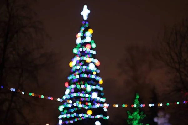 Luzes Bokeh da árvore de Natal de Ano Novo — Fotografia de Stock