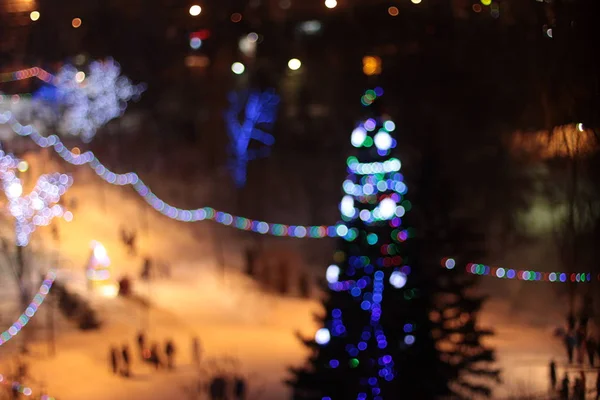 Luzes Bokeh da árvore de Natal de Ano Novo — Fotografia de Stock