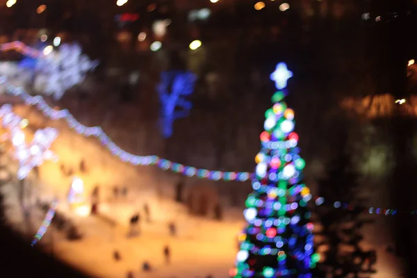 Luzes Bokeh da árvore de Natal de Ano Novo — Fotografia de Stock