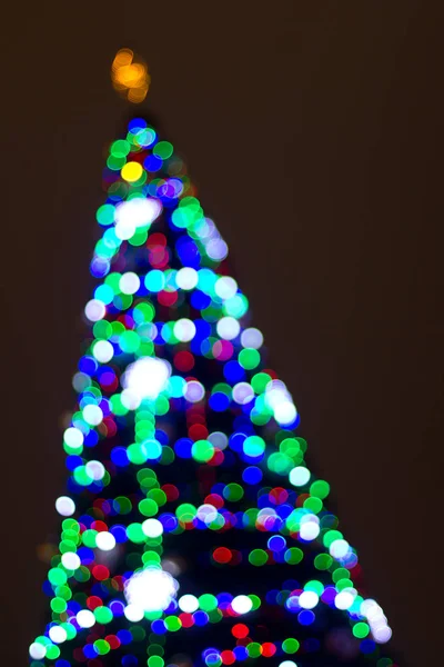 Luzes Bokeh da árvore de Natal de Ano Novo — Fotografia de Stock