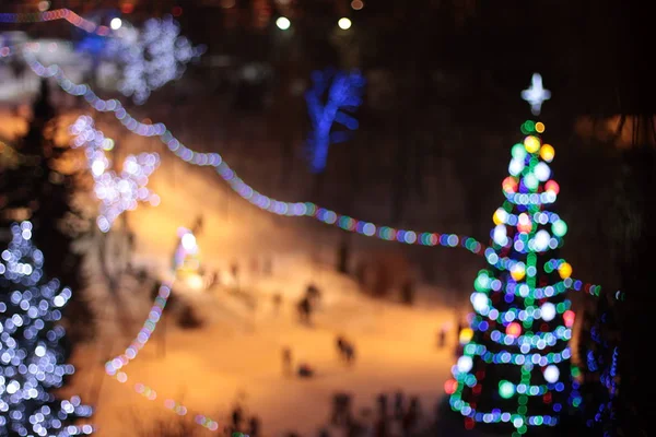 Luzes Bokeh da árvore de Natal de Ano Novo — Fotografia de Stock