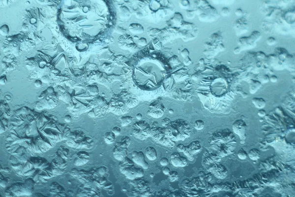 Asteroidenkrater, abstrakter Texturhintergrund. Eis am Winterfenster, Makro, selektiver Fokus. geeignet als Hintergrund für Projekte zu Kunst, Kreativität, Fantasie und Design. — Stockfoto