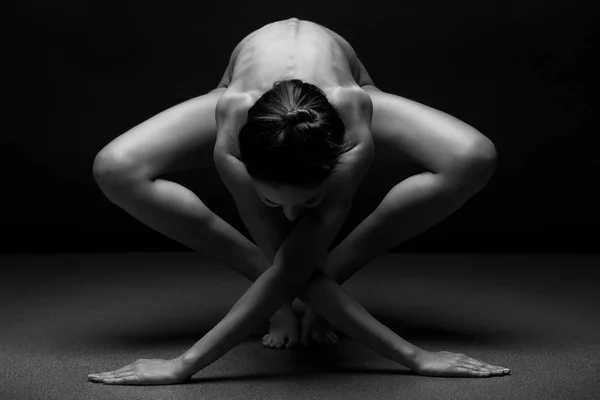 Beautiful body of young woman over dark background