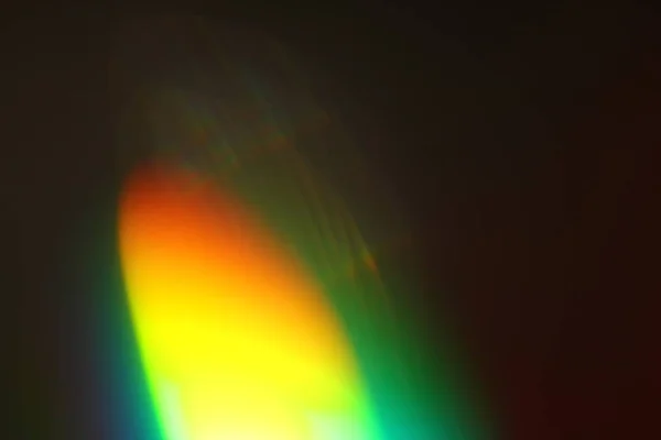 Abstract background - light color flashes and rays on black. Lens flare. For use as texture layer in your project. Add as \